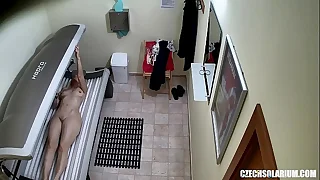 Older MILF Tanning her Shaved Parsimonious Pussy